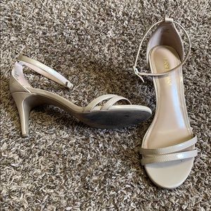 Nude strapy heels.
